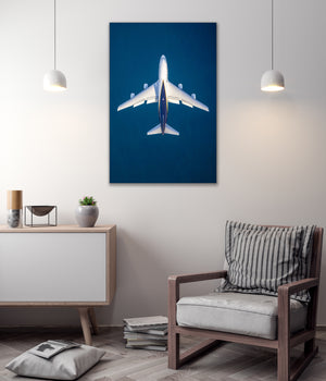 a large airplane flying in the sky, with a minimalist and modern interior design in the background.