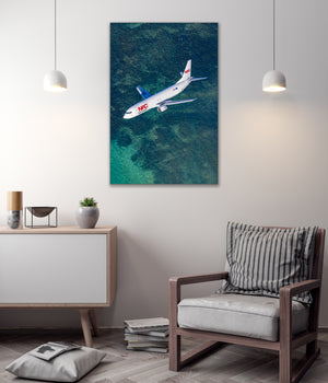 a large airplane flying over a body of water, with a minimalist and modern interior design in the background.