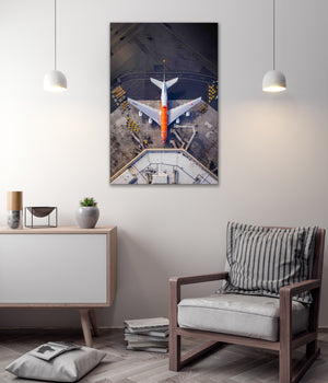 a large airplane on an airport tarmac, with a minimalist and modern interior design in the background.