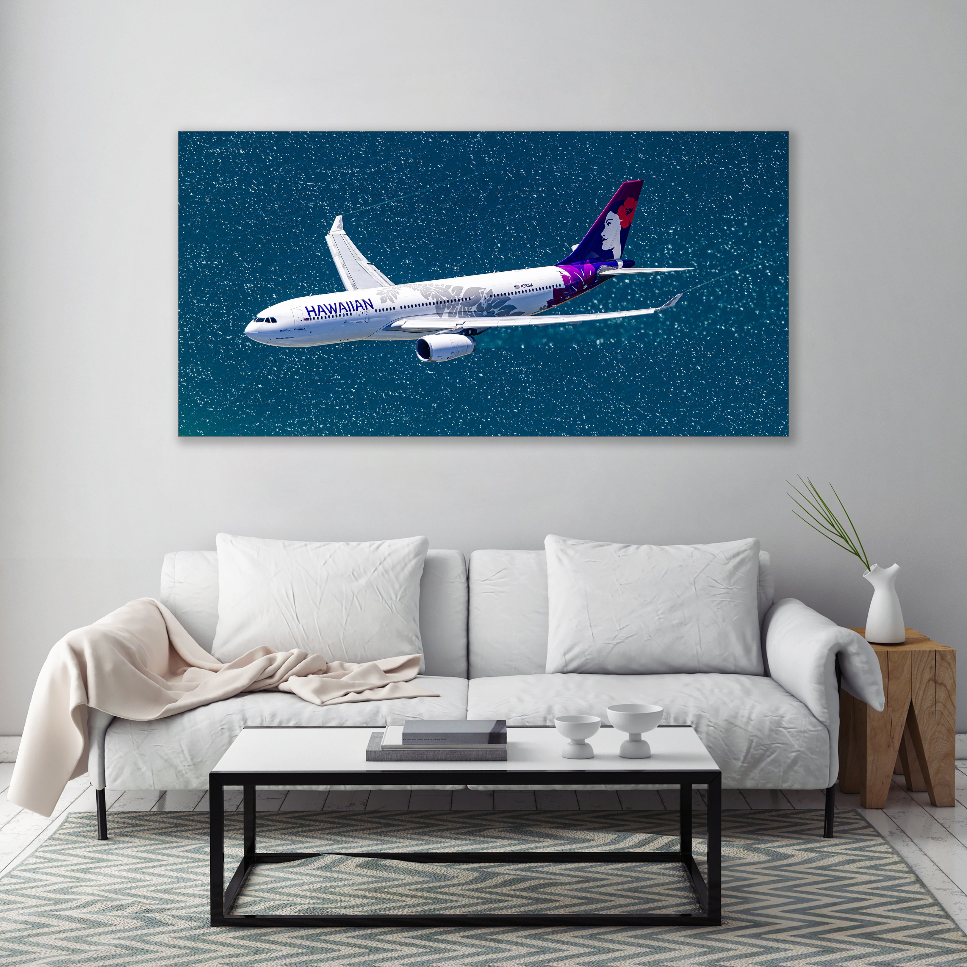 A large wall art print depicting a Hawaiian Airlines airplane flying through a starry night sky.