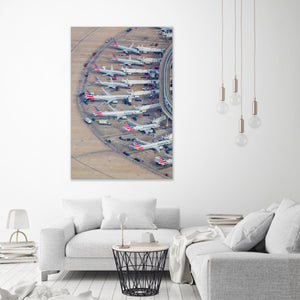 a large number of airplanes parked in a circular arrangement on a tarmac, with a total of 14 airplanes visible.